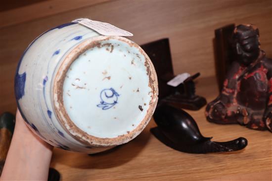 A Chinese Ming blue and white jar, Wanli period, hare mark, with hardwood stand and cover height excl. stand and cover 17cm